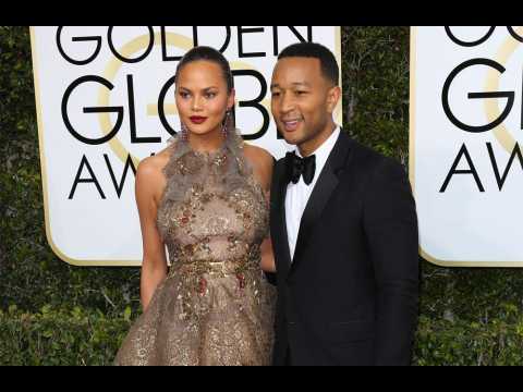 Chrissy Teigen peed on by son