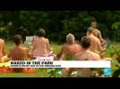 Paris: Naked in a park, Parisian nudists enjoy a hot day in the sun