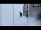 Snow Much Fun! Sakhalin Locals Leap from Buildings into Snow Piles