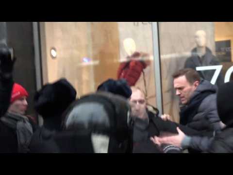 Russian police arrest Navalny at anti-Putin protest as thousands