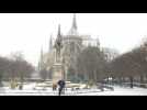 Fresh snowfall in Paris covers Notre-Dame Cathedral