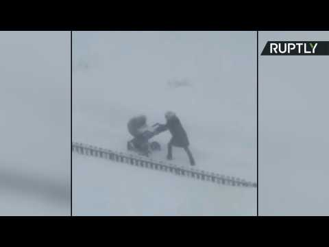 Just Out for a Stroll - Moscow Mom Struggles to Push Stroller in Record Snowfall