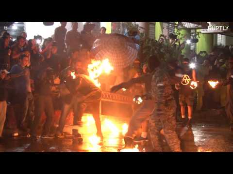 Daredevils hurl flaming FIREBALLS at each other in El Salvador