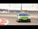 Porsche Panamera GTS Sport Turismo Driving on the track in Mamba Green Metallic