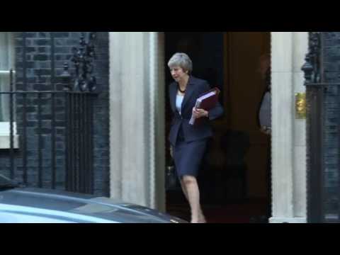 Theresa May leaves Downing Street to attend PMQs