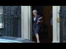 Theresa May leaves Downing Street to attend PMQs