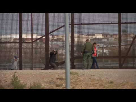 Migrants cross the US-Mexico border and turn themselves in