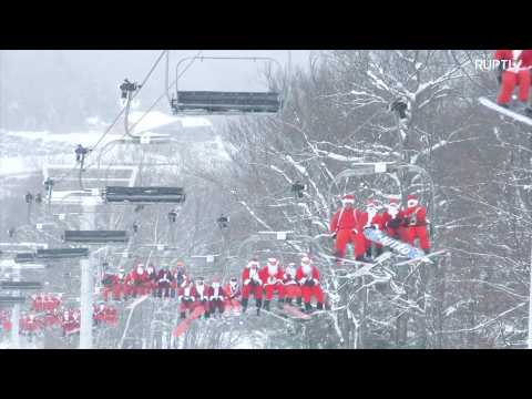 Forget rain deers! Hundreds of Santas sliding down on skies for charity