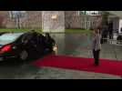 British PM Theresa May locked in car as she meets Angela Merkel
