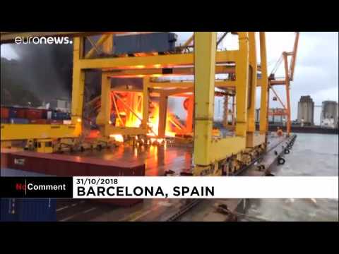 Fire breaks out after ferry collides with crane at Barcelona port