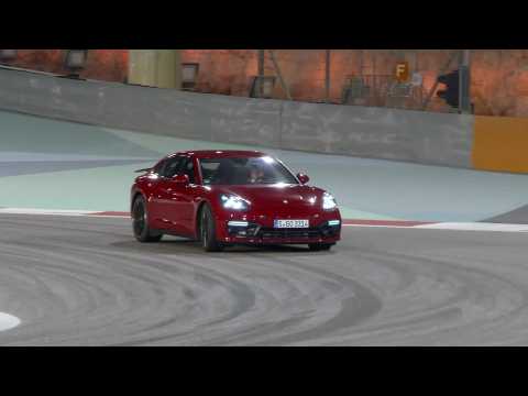 Porsche Panamera GTS in Carmine Red Night driving on the track