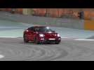 Porsche Panamera GTS in Carmine Red Night driving on the track