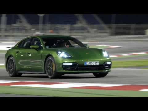 Porsche Panamera GTS in Mamba Green Metallic Night driving on the track