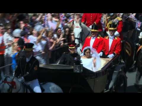 Harry and Meghan travel down the King's Road in their carriage.