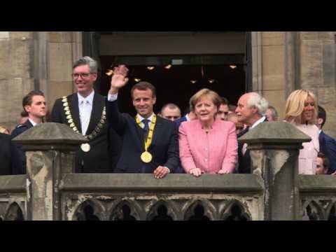 Macron greets people in Aachen after receiving Charlemagne Prize