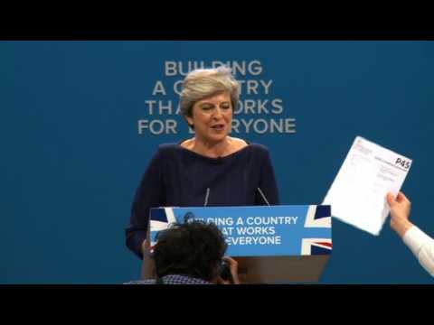 Protester interrupts Theresa May's speech, hands her P45