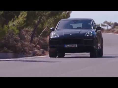 Porsche Cayenne Turbo Driving on the road in Moonlight Blue Metallic