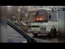 Only in Russia! Man Casually Drives Burning Bus on Street