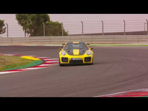 Porsche 911 GT2 RS in Racing Yellow Driving on the track