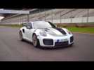Porsche 911 GT2 RS in White Driving on the track