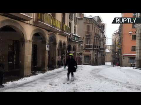 Fan-Propelled Skier Zooms Through Snowy Spanish Streets