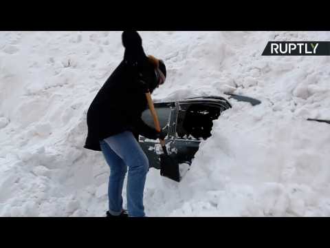 Snow Way Out? Man Digs Car Out from Massive Snowbank