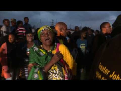 Wellwishers sing, dance at Winnie Mandela's home after her death