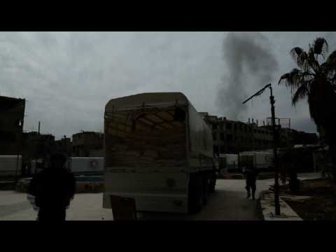 Syria aid convoy pauses temporarily as mortars hit nearby