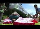 Aid pours into Indonesian city stricken by quake-tsunami