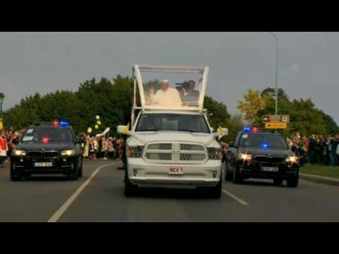 Pope Francis drives through streets of Vilnius in Popemobile