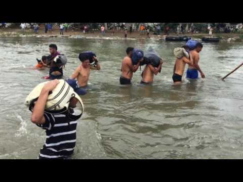 Migrants cross Suchiate river into Mexico