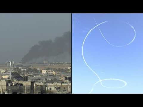 Smoke billows over Khan Yunis, aircraft flies over Rafah
