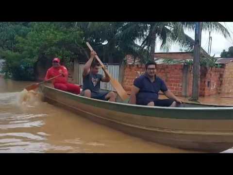 Residents move by boat in Bolivian flooded town after river overflows