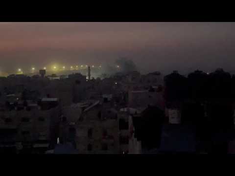 Plumes of smoke are seen rising from western Rafah