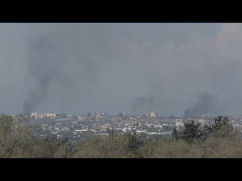 Plumes of smoke rise over southern Gaza, seen from Israel