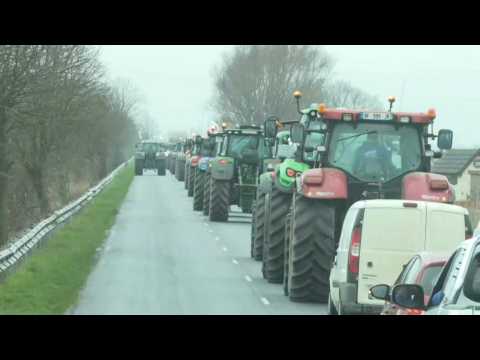 Angry French farmers drive tractors on main road near Dunkirk