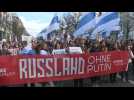 Protesters gather near the Russian embassy in Berlin on last day of presidential election