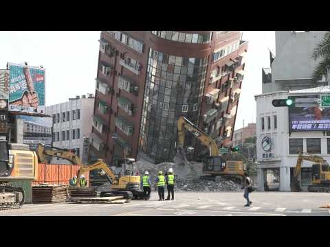 Emergency crews work near heavily-tilted building in Hualien after Taiwan quake