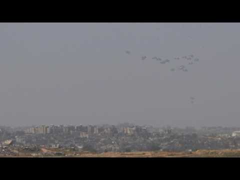 Aid airdropped over Gaza, seen from Israel