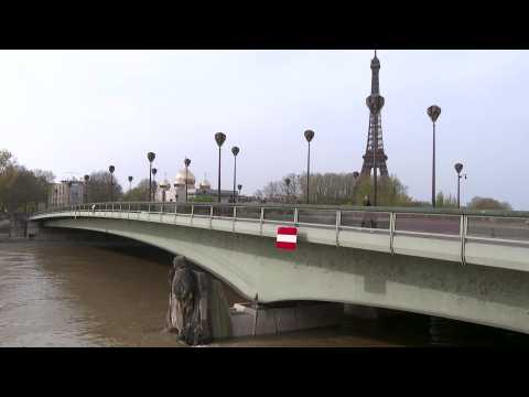 Paris's Seine river reaches peak flood, covering feet of statue