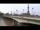 Paris's Seine river reaches peak flood, covering feet of statue