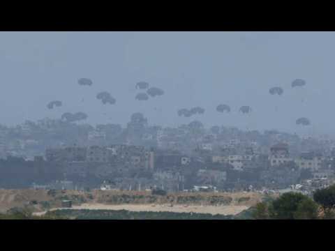 Aid packages airdropped in northern Gaza, seen from Israel