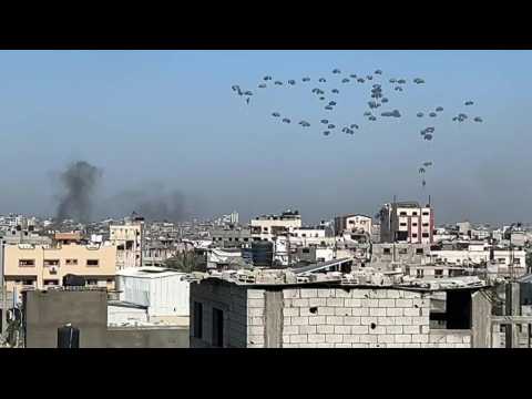 Smoke rises as aid is airdropped over Gaza City