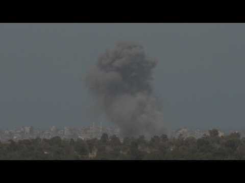 Plume of smoke rises over central Gaza, seen from Israel