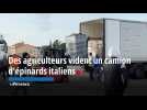 Des agriculteurs vident un camion d'épinards italiens à Châteaurenard