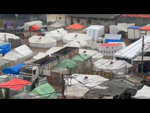Makeshift tents flooded by heavy rain in Rafah