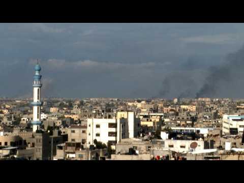 Smoke billows over Gaza's Khan Yunis as seen from Rafah
