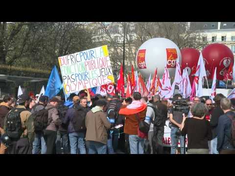 French civil servants demonstrate in streets of Paris over pay