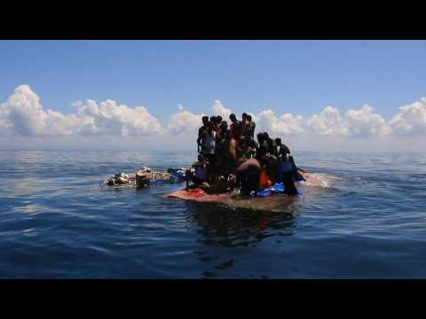 Indonesian authorities rescue stranded Rohingya holding onto overturned boat