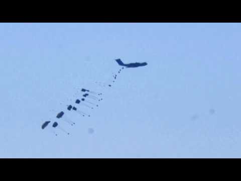 Humanitarian aid parachuted into the Gaza Strip via airdrop